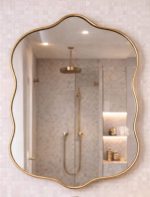 Wavy Brass Vanity Mirror with curved solid brass frame and clear glass for bathroom wall