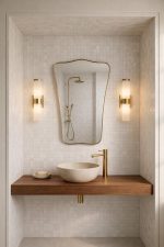 Curved Rectangle Brass Mirror with handcrafted slim brass frame in a modern bathroom vanity setting