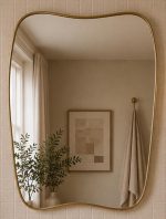 Organic Brass Mirror handcrafted with an irregular solid brass frame for modern bathroom wall décor
