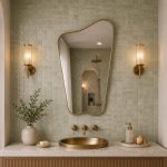 Organic Brass Mirror with irregular asymmetrical frame above a bathroom vanity