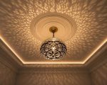 Globe Moroccan Brass Pendant Light casting decorative patterned shadows across ceiling