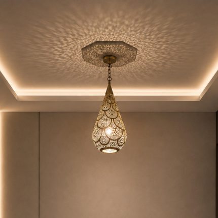 Teardrop Moroccan Brass Pendant Light handmade pierced brass hanging lamp casting decorative ceiling shadows
