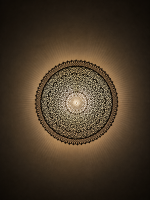 Round Filigree Brass Wall Light with intricate hand-perforated brass design