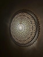 Round Filigree Brass Wall Light with intricate hand-perforated brass design
