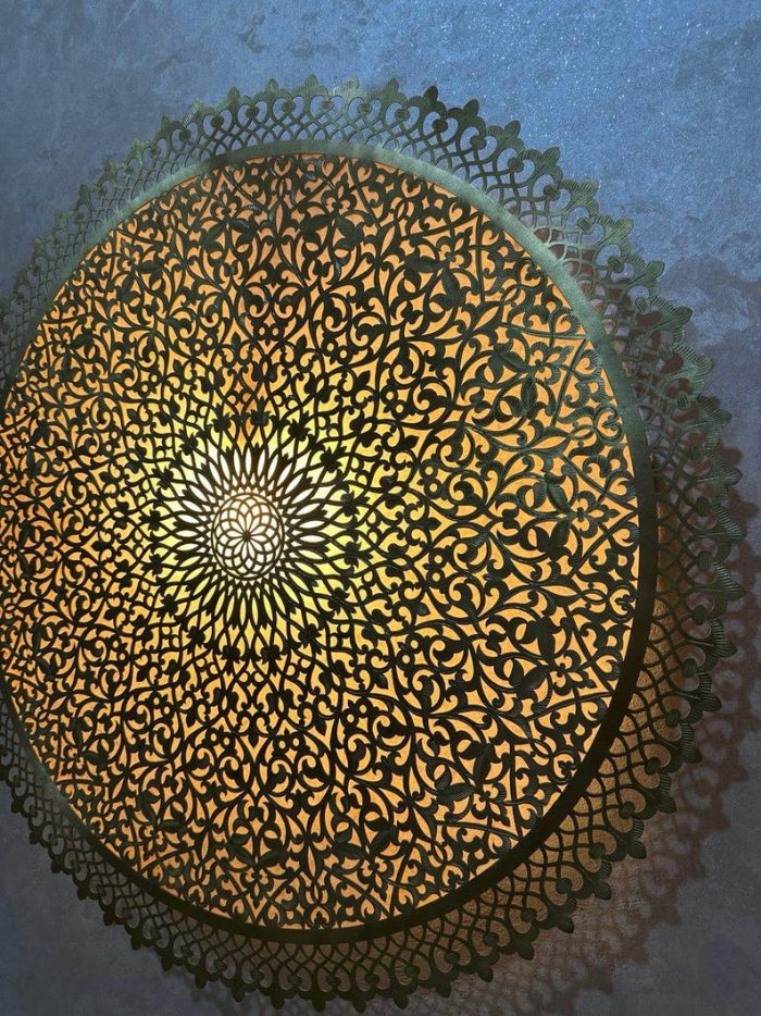 Round Filigree Brass Wall Light with intricate hand-perforated brass design